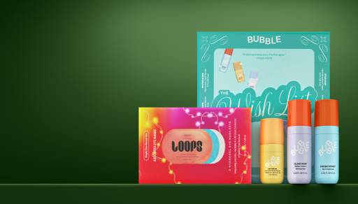 An image of holiday beauty gift sets and individual beauty products lined up.