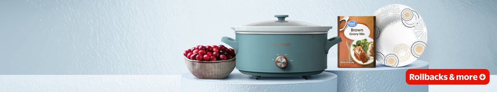 A crockpot, cranberries, gravy mix, and paper plates are visible.