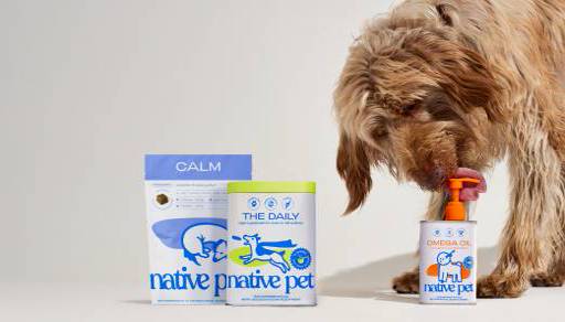 A dog sniffs Native Pet products, omega oil, daily supplements and calm chews.