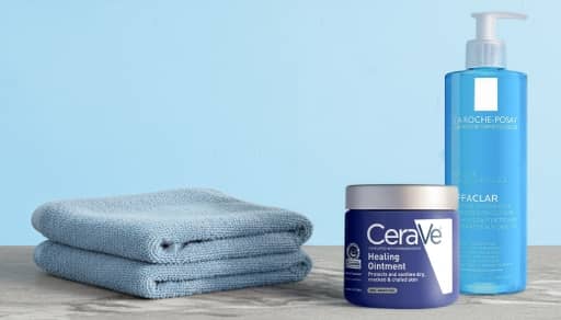 CeraVe Healing Ointment and La Roche-Posay skincare next to bathroom towels.