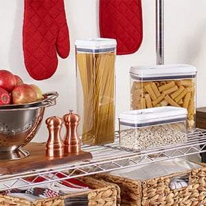 Plastic food containers on metal shelf