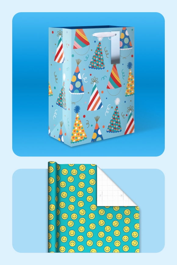 Paper gift bag with Christmas trees shown with smiley-face design wrapping paper.