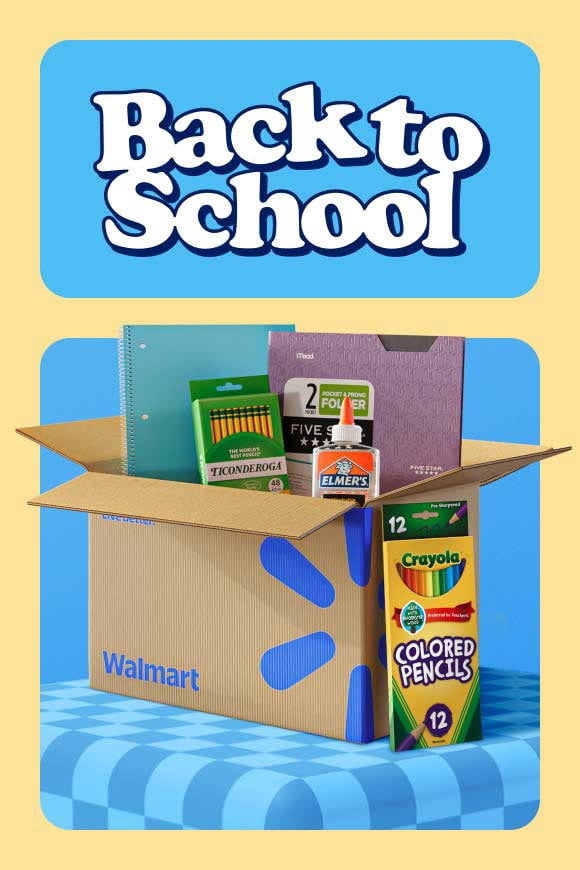 A Walmart shipping box filled with glue, notebooks, folders and pencils, next to colored pencils.