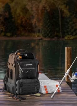 A backpack, rod and reel on a dock.