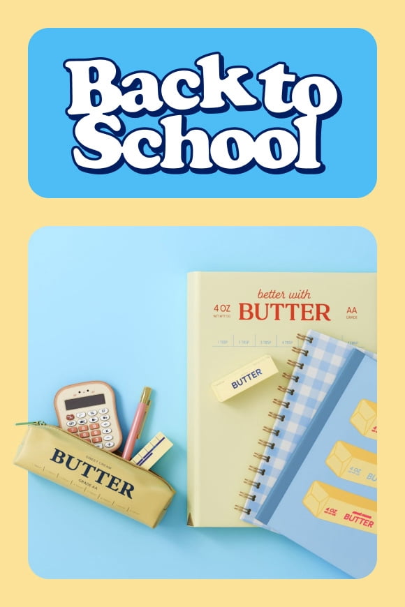 School supplies patterned in a butter theme: notebooks, an eraser, and a pencil case with accessories.