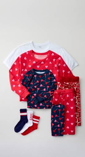 From nine dollars. Red and pink heart-printed pajama sets are pictured with striped socks.