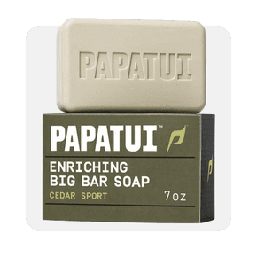 Image shows a PAPATUI Enriching Big Bar Soap, Cedar Sport, with green packaging and beige soap bar on a white background.