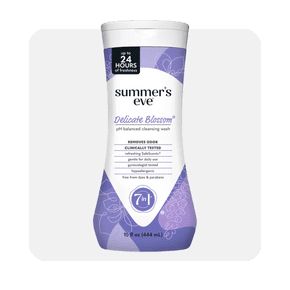 Image shows a bottle of Summer's Eve Delicate Blossom daily feminine wash with a purple design on a white background.