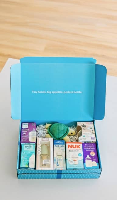 An open box filled with daily essentials and a plush toy.