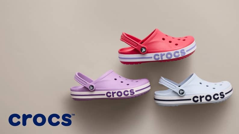 Three Crocs Bayaband clogs in salmon pink, lavender and light blue.