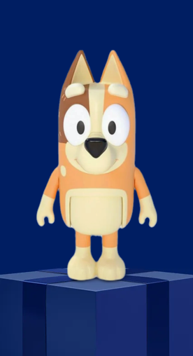 Image shows an orange and cream Bluey action figure from Bluey on a dark blue background.