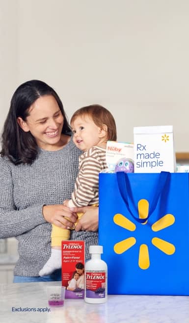 A mom and baby are shown behind a counter with Tylenol kids’ cold and flu meds and a Walmart bag filled with prescriptions and a Nuby octopus toy.