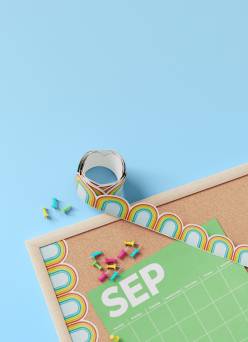 A bulletin board, calendar, and a patterned border on a blue background.