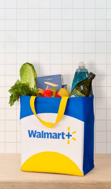 An image of a grocery bag with the Walmart+ logo. Text: Get free curbside pickup & Delivery with Walmart+ Assist. Learn more.