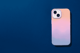 Back of smart phone in a gradient pink-orange case.