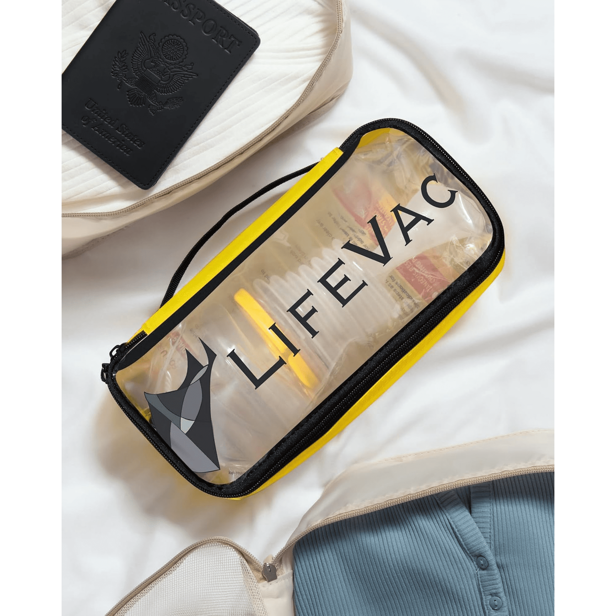 Image shows a Lifevac emergency device in a transparent yellow case, placed on a white surface near other travel items, with a white background.