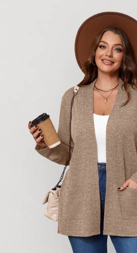 A woman in a casual fall outfit holding a coffee.