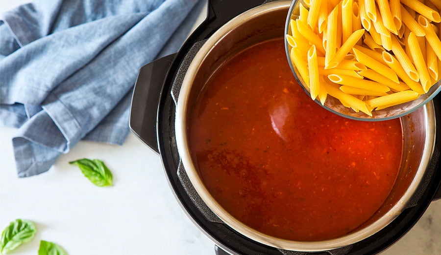 Adding penne pasta to soup base