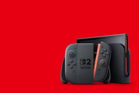 Nintendo Switch 2 console on a red background.