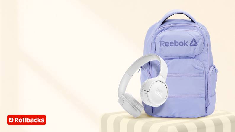 Rollbacks badge in the bottom left corner. A purple Reebok backpack and white headphones are on top of a yellow platform.