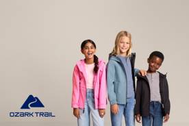 Ozark Trail logo. Four children wearing colorful Ozark Trail outerwear are pictured on a beige backdrop.