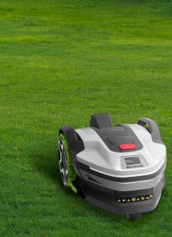 A smart mower on a green lawn.