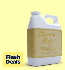 Flash deals. Image shows a white container of Tyler Candle Company's Glamorous Wash Diva laundry detergent on a pale yellow background.