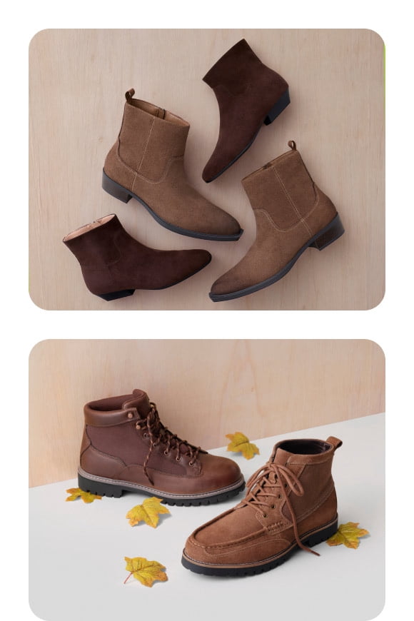 Brown suede ankle boots and lace up hiking boots arranged with scattered autumn leaves.