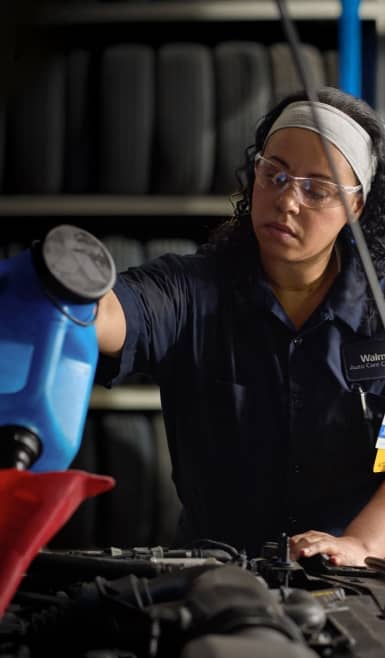 A person working on a car.