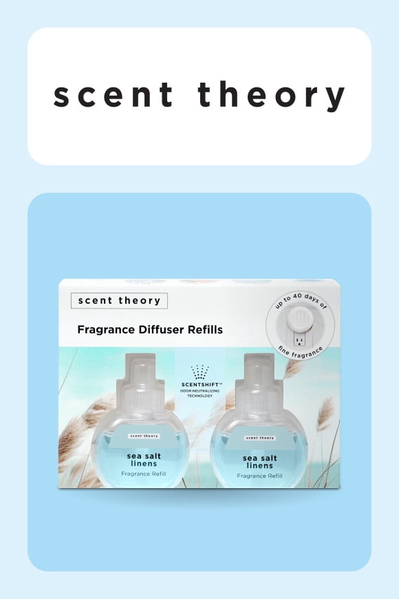 A two-pack of clear fragrance diffuser refills against a beachy background with soft sand and grass.