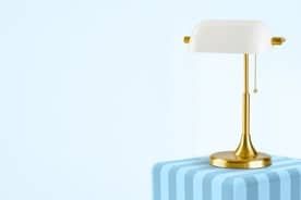 A chic retro desk lamp with gold detailing.