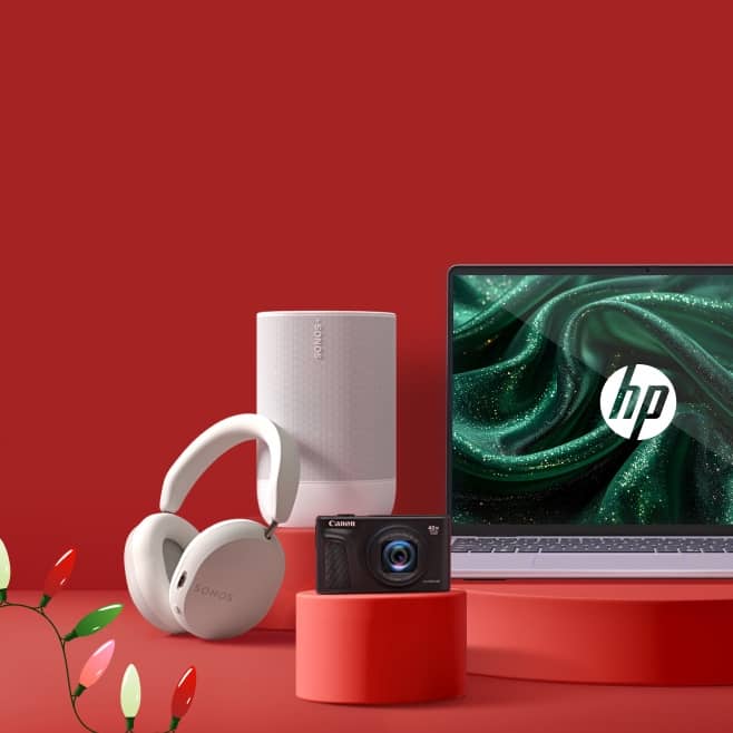 View white Sonos headphones and speaker, a black Canon camera and silver HP laptop.