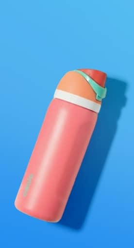 Three colorful reusable water bottles standing upright on a round platform against a blue background.