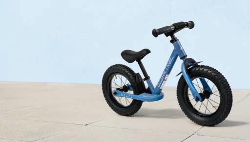 Blue balance bike shown.