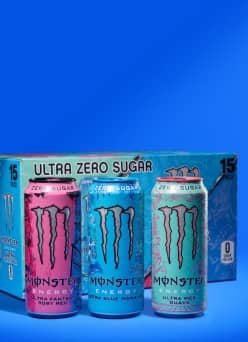 Monster Energy Ultra Zero Sugar variety pack box with three cans in pink, blue and teal, highlighting zero sugar and fifteen pack count.