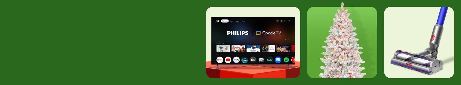 A Philips seventy-five inch four K T V, a lit-up Christmas tree, and a Dyson cordless vacuum cleaner.