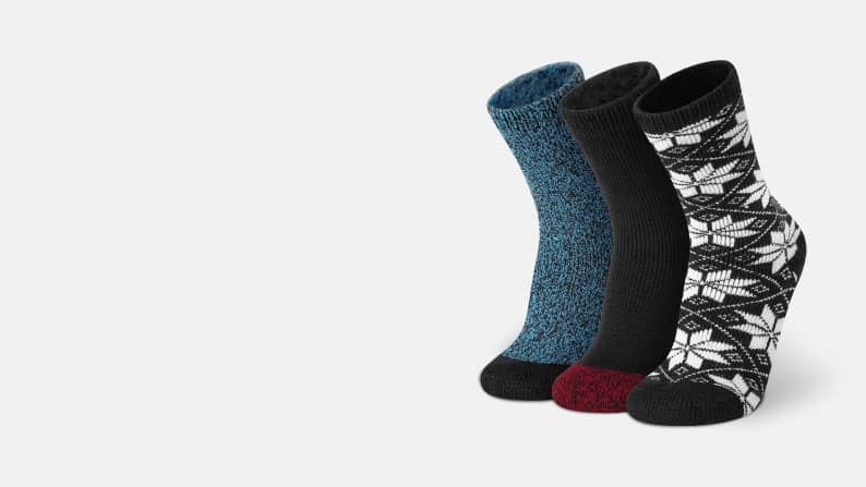 A trio of stylish socks, including two solid designs and one snowflake print.