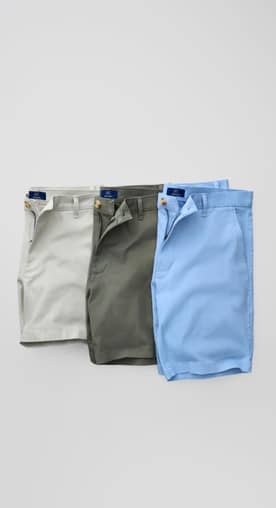 Image laydown of three pairs of men’s tailored shorts for summer.