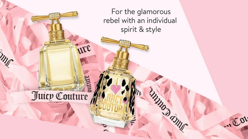 Two Juicy Couture I Love Juicy bottles on a pink background.
