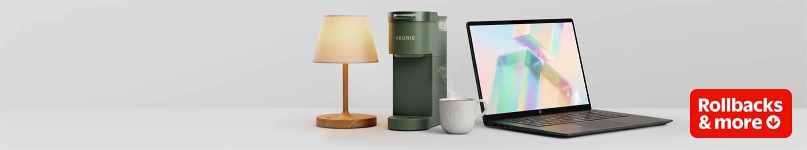 A laptop, a lamp, a Keurig coffee maker, and a Rollbacks & more badge.