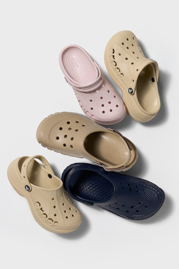 A variety of Crocs in different colors & sizes.