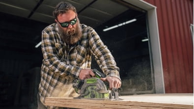 man using greenworks tool