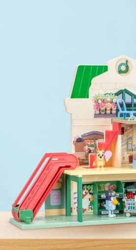 Image of Bluey “Let’s Play Chef” toy. It is a three-story building with a play supermarket, kitchen and figurines.