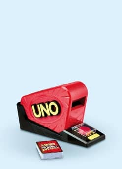 Uno card shooter with tray of colorful cards and a separate Uno deck in front.