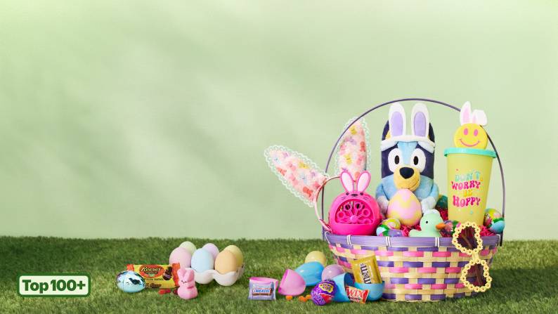 Top one hundred plus. Dyed and prefilled eggs next to a basket with bunny ears, a Bluey plushie, water bottle, eggs, sunglasses and bubble machine.