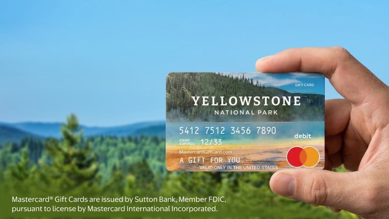 A Yellowstone-themed gift card against a background of trees and sky.