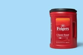 A canister of Folgers classic roast is shown on a counter.