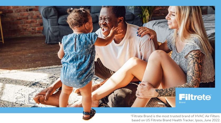 Two parents and their daughter enjoy playtime together.