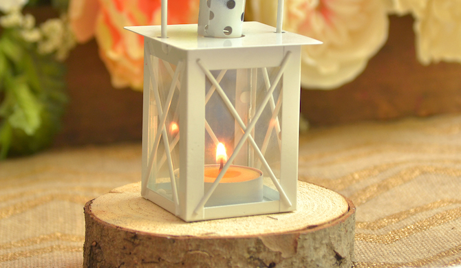 A Lantern Resting On Rustic Wood Coaster A Lantern Resting On Rustic Wood Coaster