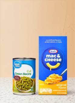 A can of Great Value cut green beans is shown next to a box of Kraft macaroni and cheese.